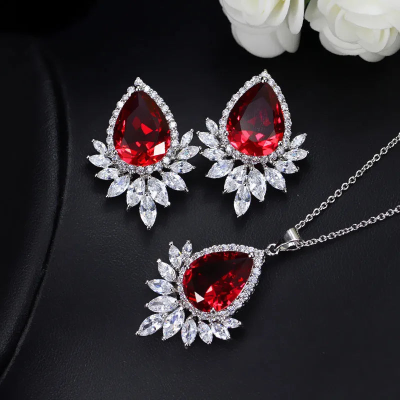 Silver-tone jewellery set with cubic zirconia stones including necklace, bracelet and earrings for formal events