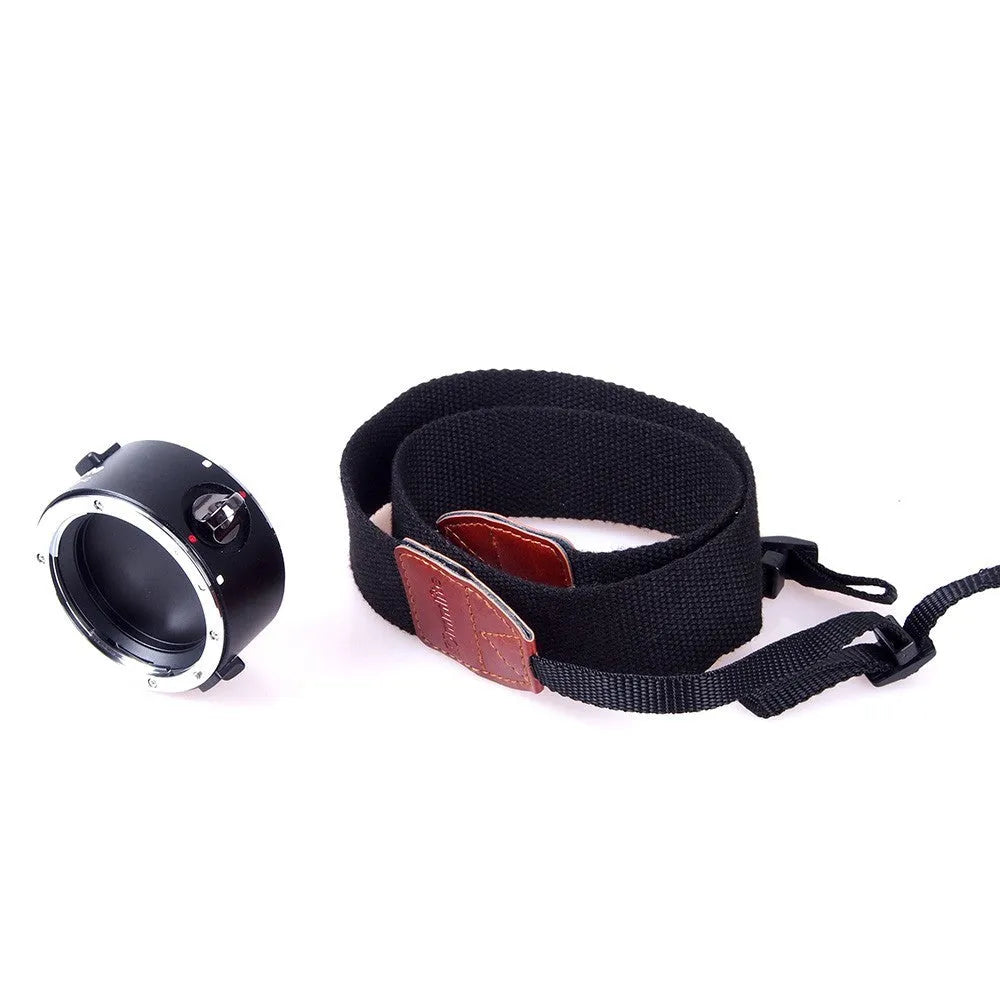 Aluminium alloy Nikon camera lens flipper dual holder with stainless steel buckle and cotton strap.