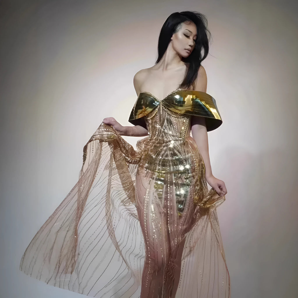Gold sequined strapless evening dress with high-leg split and tulle underlay