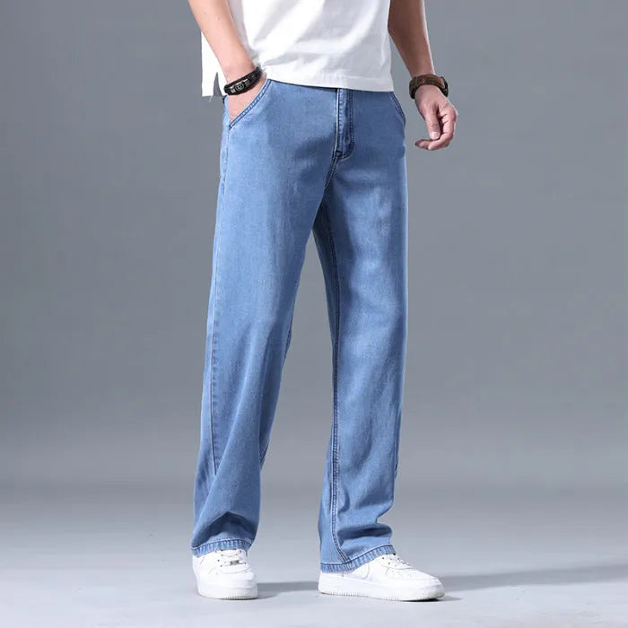 Men's loose straight-leg lyocell jeans in light blue with zipper fly closure