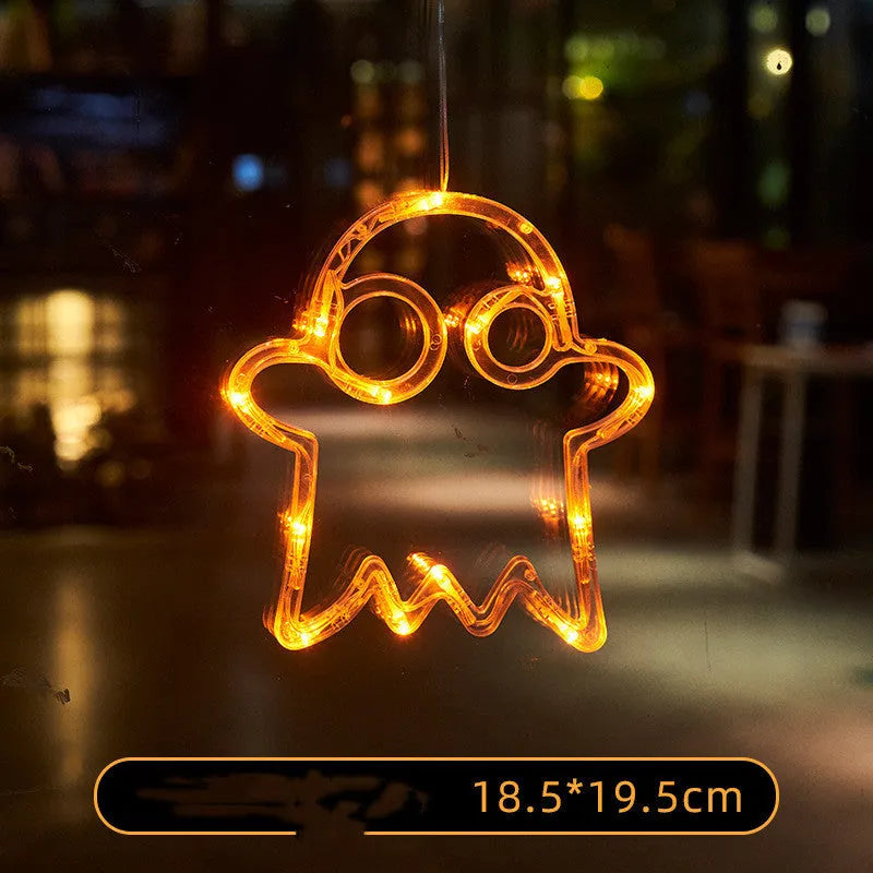 Set of seven battery-powered Halloween LED hanging lights with ghost, spider, and pumpkin designs for window decoration.