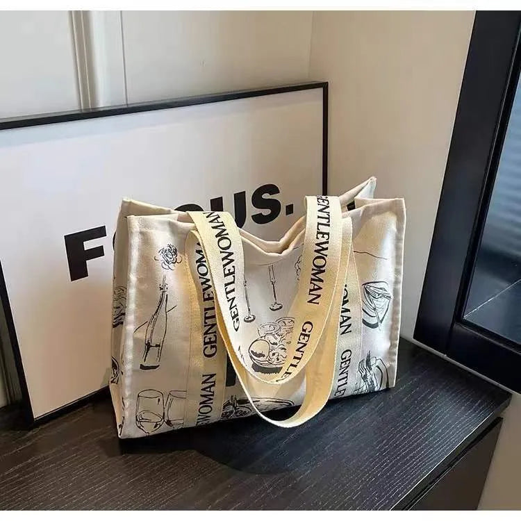 Canvas women's tote bag with printed letter or pattern designs and shoulder straps