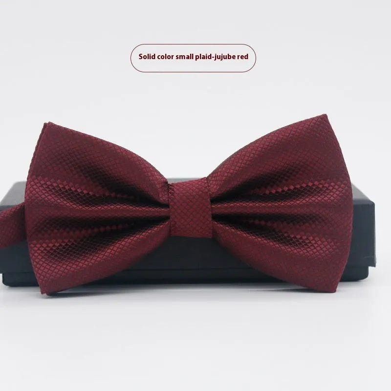 Men's flat head solid colour bow tie in polyester, showing 12cm by 6cm size on a background.