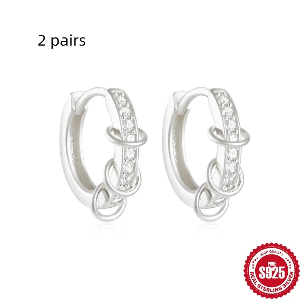 Sterling silver geometric stud earrings with small round designs in gold or silver electroplated finishes