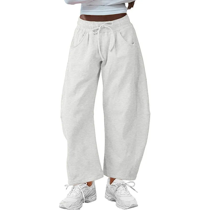 Loose cropped sweatpants with drawstring waist and side pockets in European street style