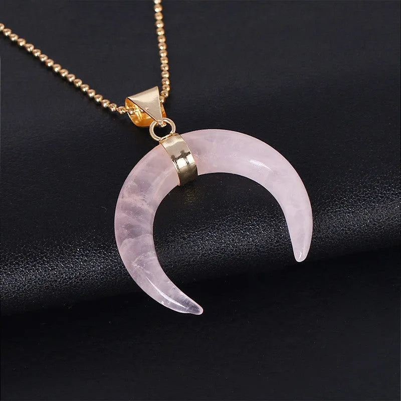 Natural semi-precious stone moon pendant necklace on a 45cm copper chain, shown in pink and purple colour options.