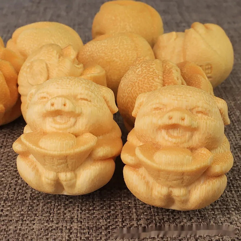 Solid bamboo carving ornament of a Fu Lu pig ingot, 4cm tall.