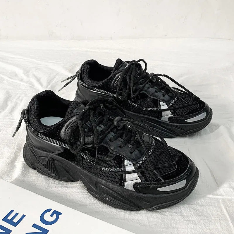 Men's white platform dad sneakers with a lace-up front and thick sole, shown on a grey background.