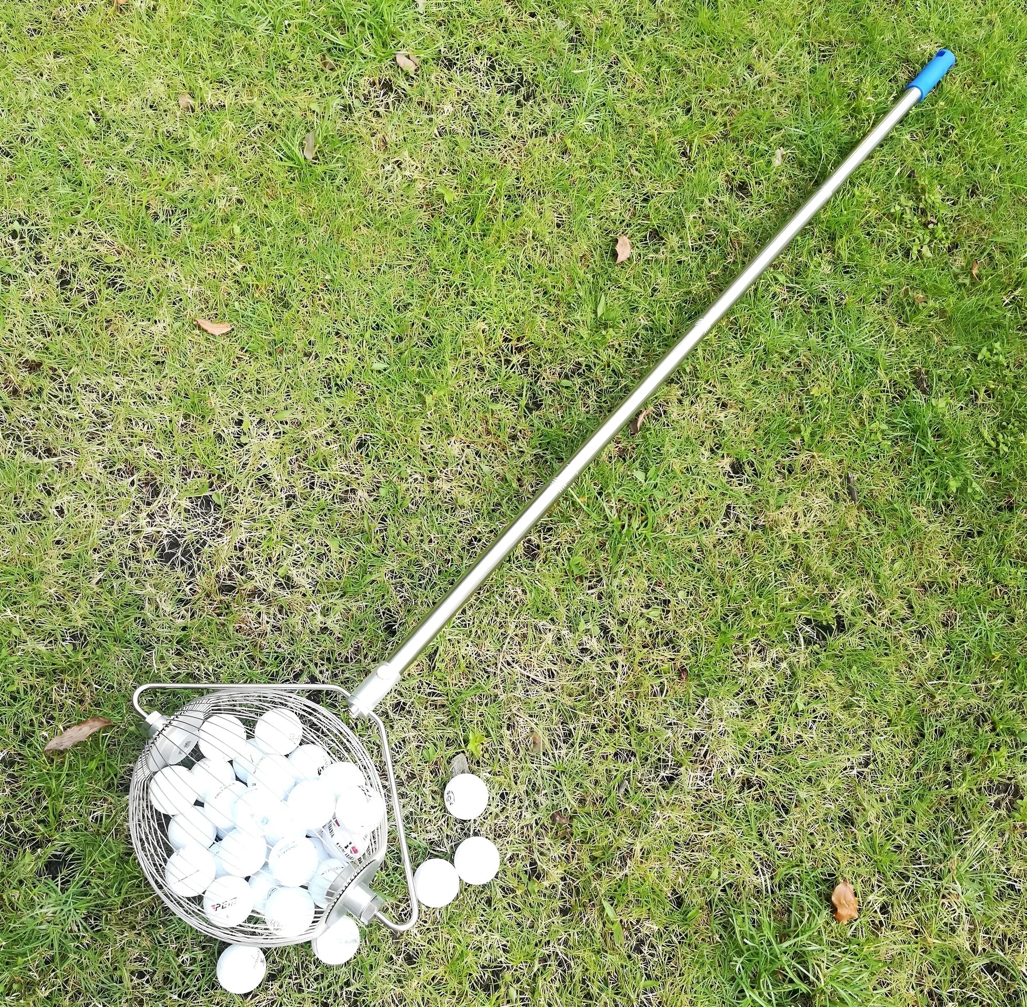 Stainless steel golf ball picker tool with a metallic finish.
