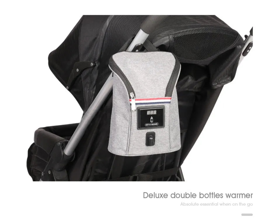 Grey Oxford cloth portable baby bottle warmer bag for car use with 12V charger and temperature display.