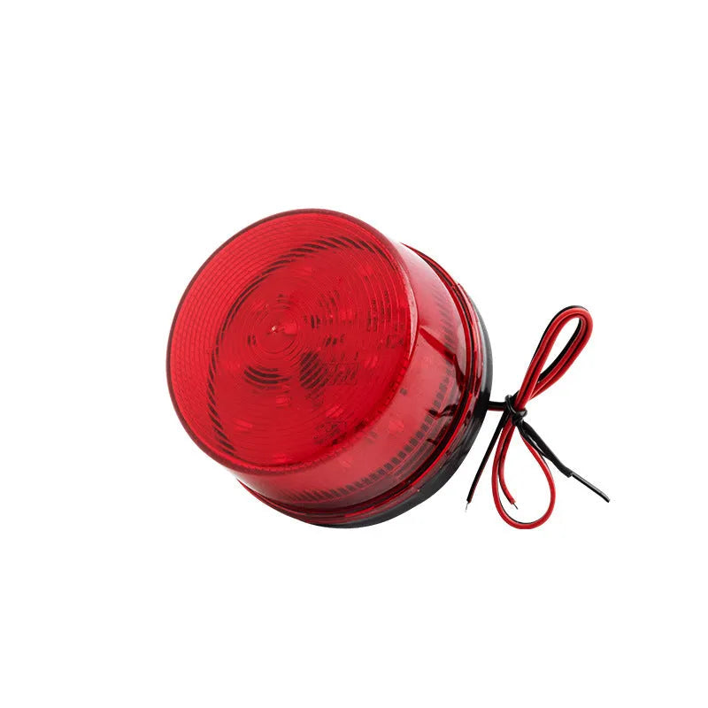 Small red 24V warning and alarm light with strobe flash and siren, model HC-79, on its mounting base.