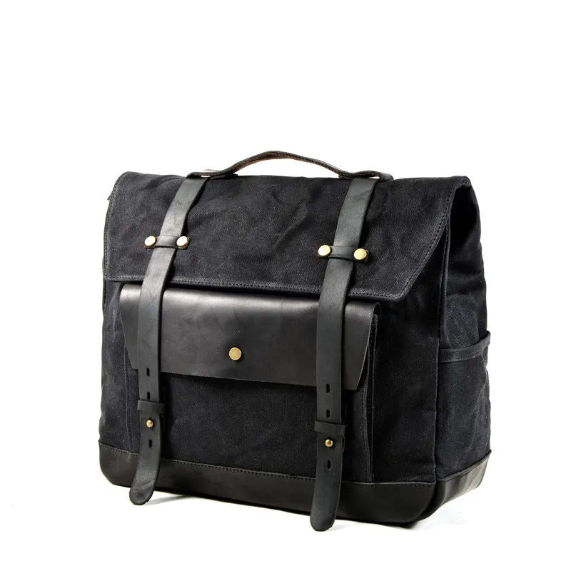 Cotton retro-style messenger bag showing internal organiser pockets and rivet detailing.