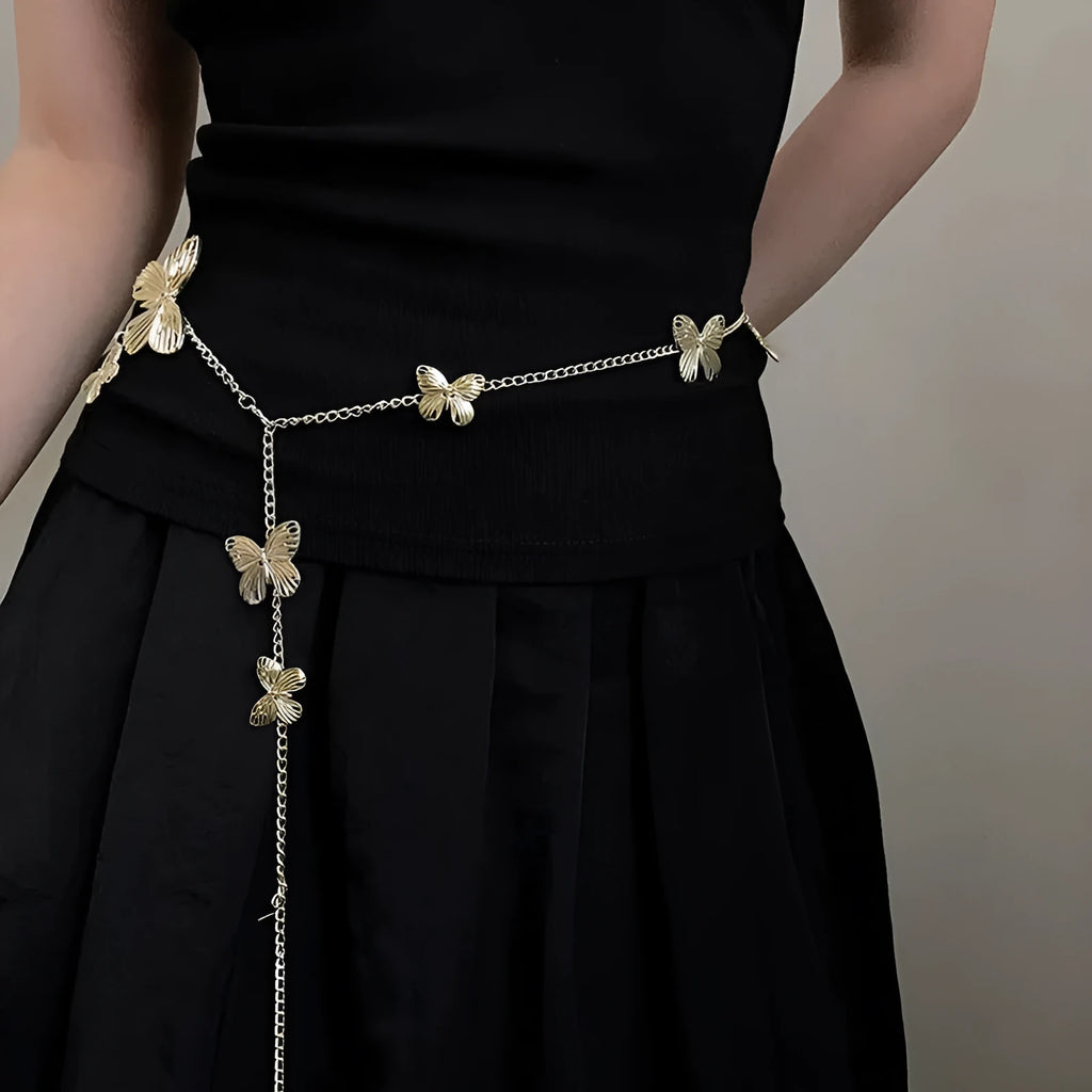 Gold and silver alloy waist chain with butterfly ornament, showing 104cm length.