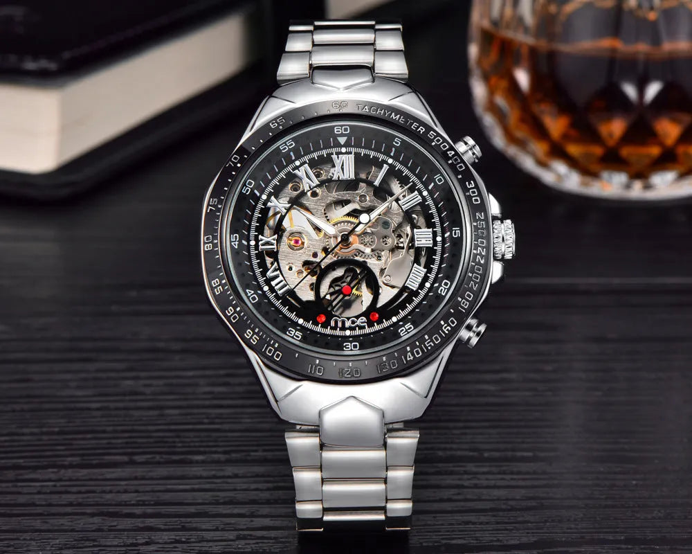 Men's mechanical watch with stainless steel case and brown leather strap showing luminous hands and date window