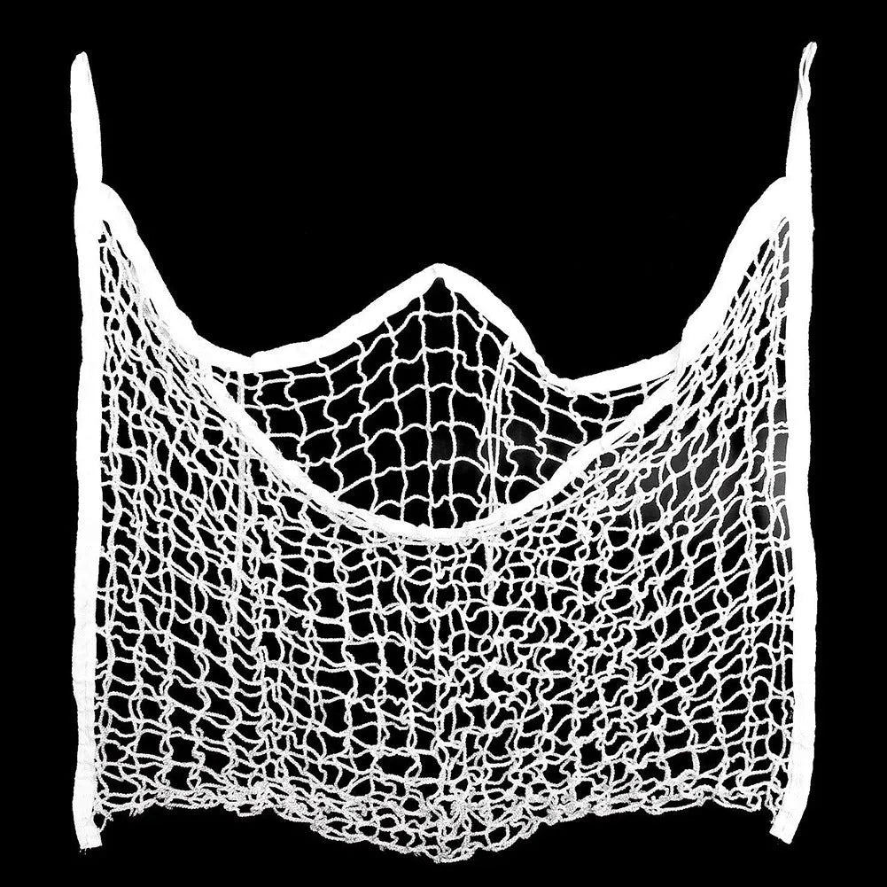 Black woven grid horse feeding bag hanging, filled with hay, for cattle or sheep.