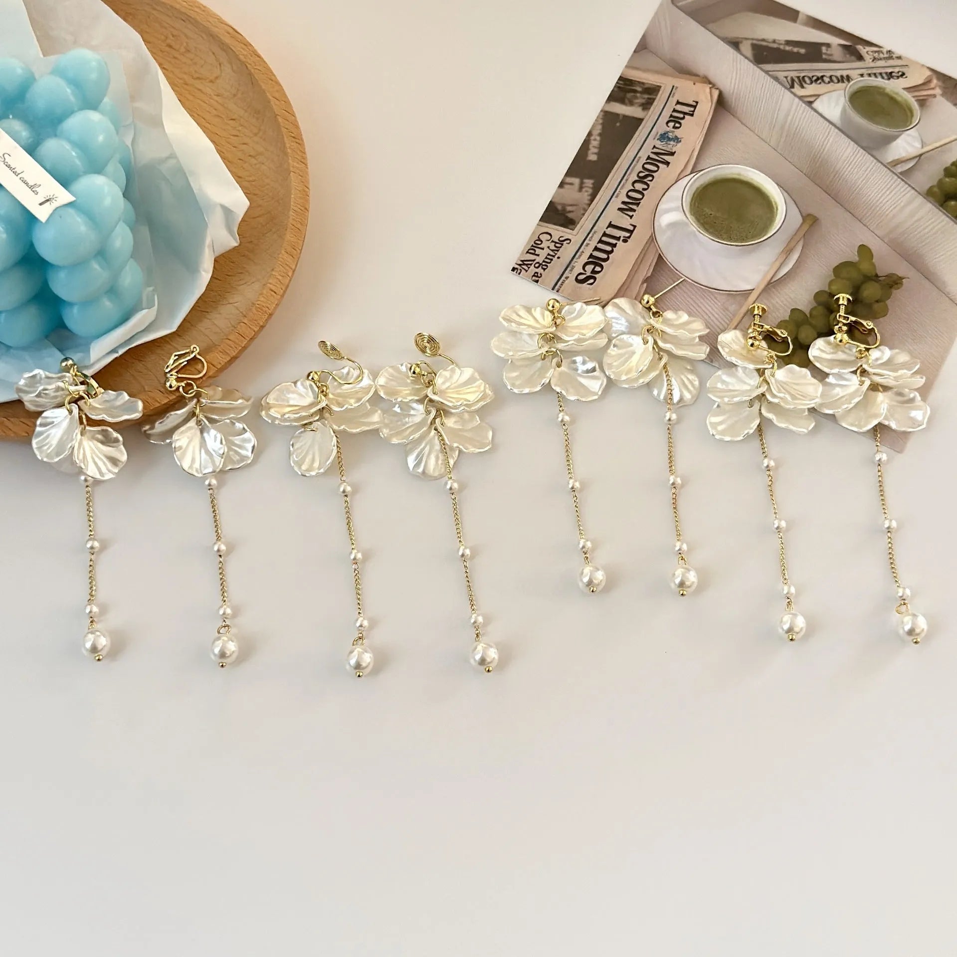 Women's acrylic shell pearl tassel earrings showing 8.8cm length and four fastening style options