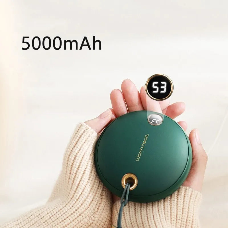 Green hand warmer power bank with digital display showing 5000mAh capacity and heating function