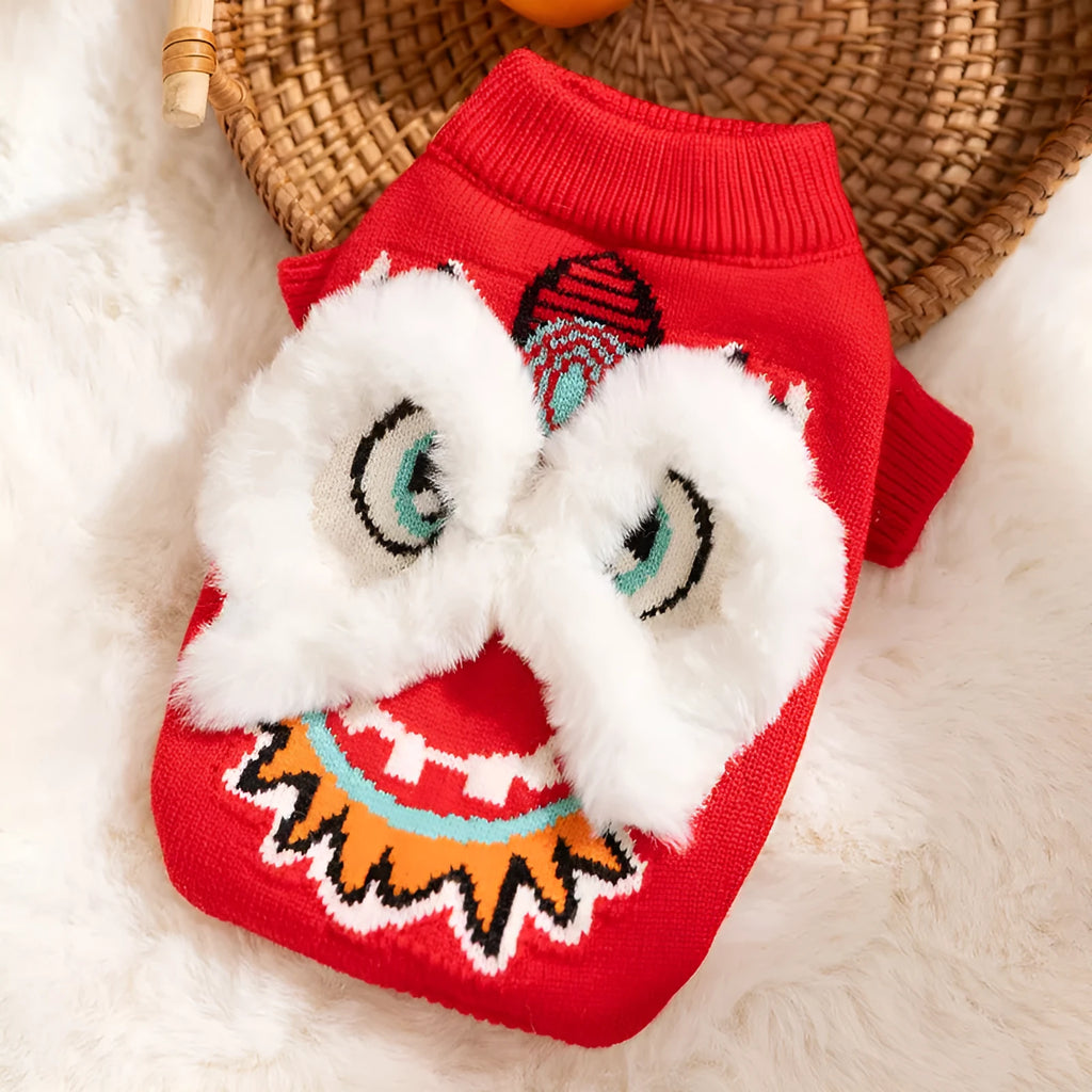 Red knitted lion dance pet sweater with 3D plush face details and colourful embroidery on a cat