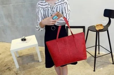 Minimalist European-inspired shoulder handbag in black or grey with adjustable strap