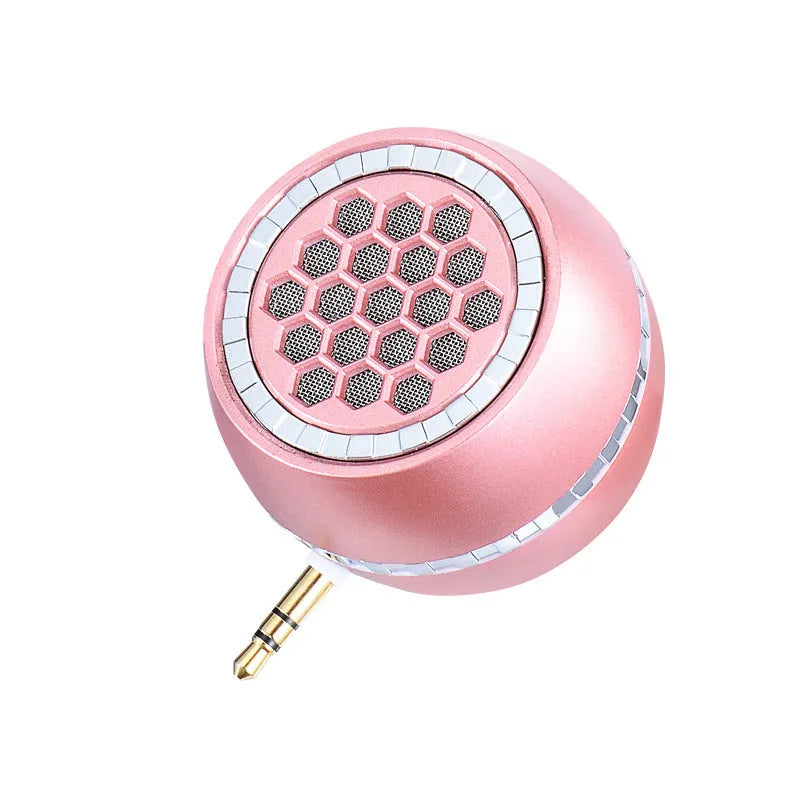 Universal external amplifier speaker in black, gold, or rose gold, showing input for 5V charger.