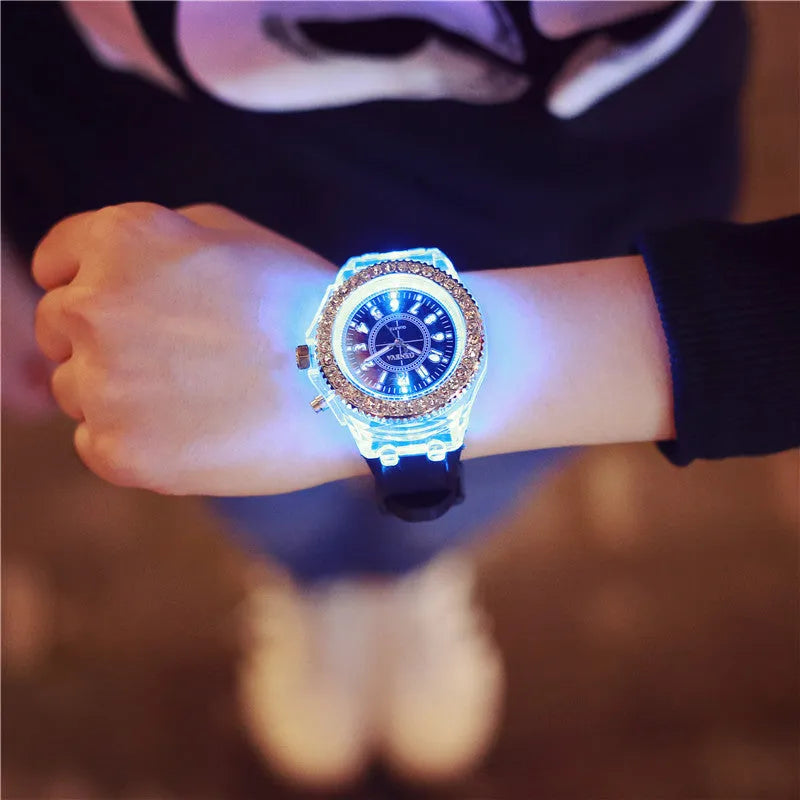 Women's LED luminous quartz watch with round 43mm alloy case and colourful silicone strap options.