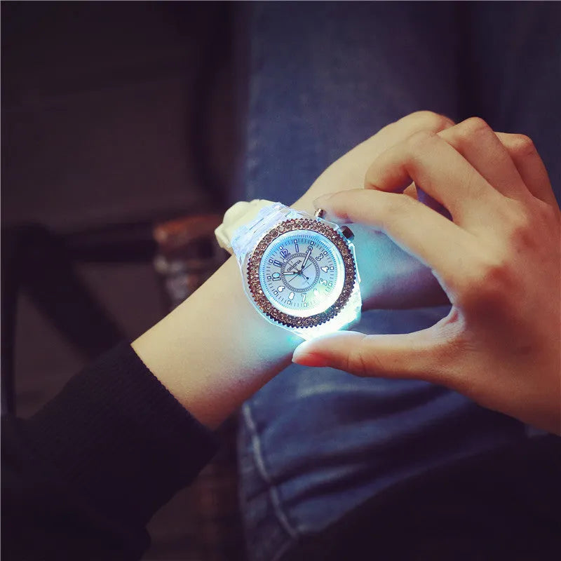 Women's LED luminous quartz watch with round 43mm alloy case and colourful silicone strap options.