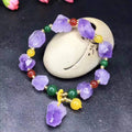 Women's natural style amethyst bead bracelet with a decorative fu character.
