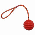 Multi-colour rubber dog ball toy with rope knot handle measuring 6x30cm