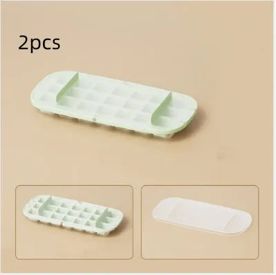 Yellow lever-operated ice cube tray grid with high capacity design and stored ice shovel.