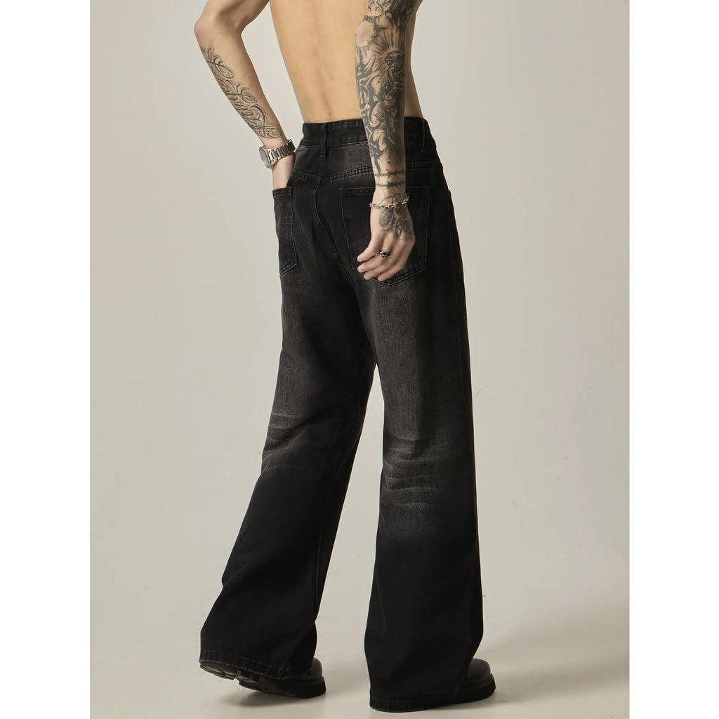 Black loose-fit straight-leg retro jeans on a mannequin, showing zip fly and casual style.