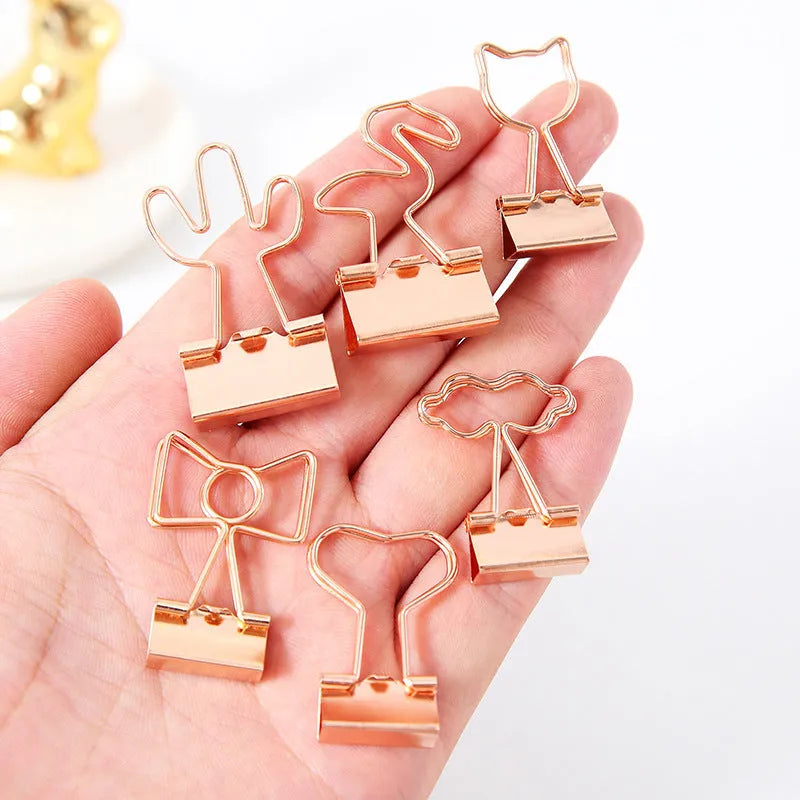 Gold-plated long-tail metal clip with a choice of bow, cactus, cat, flamingo, love, or cloud decorative design.