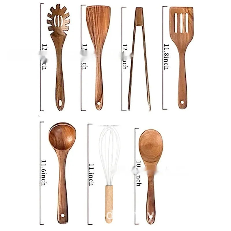 Boxed set of seven wooden kitchen spoons and spatulas on a table.