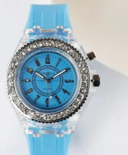 Women's LED luminous quartz watch with round 43mm alloy case and colourful silicone strap options.