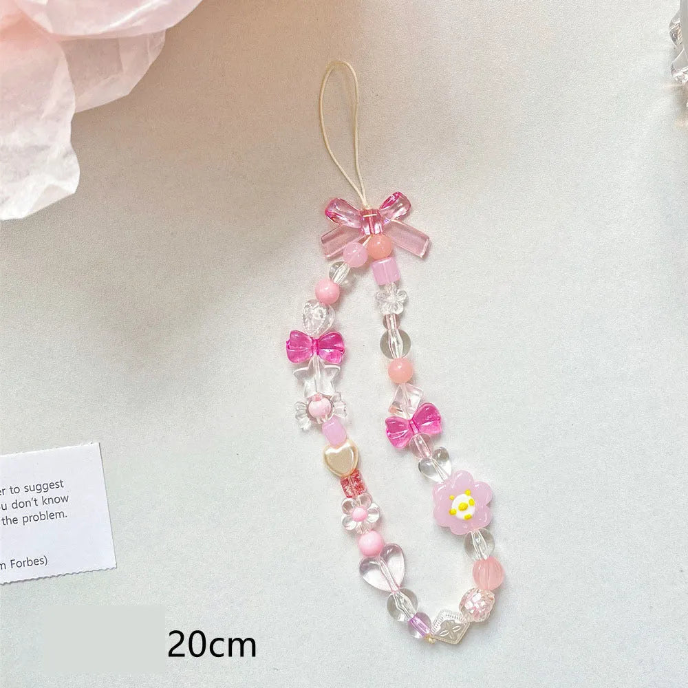 Beaded flower mobile phone lanyard with floral designs in yellow, blue, and pink colour options