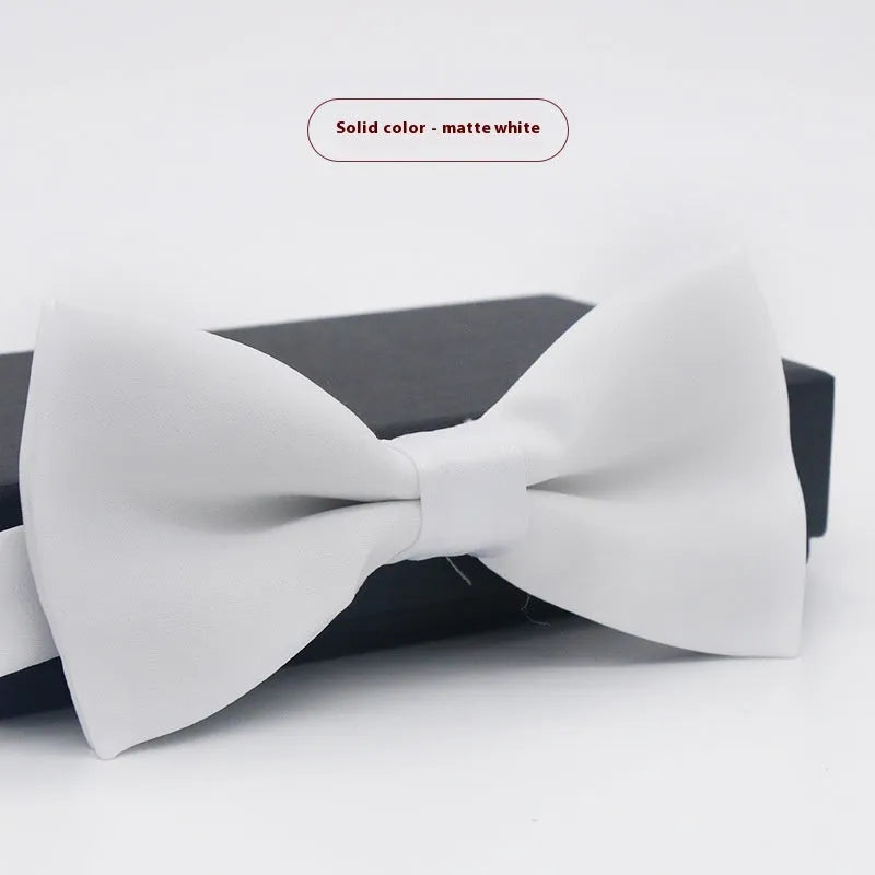 Men's flat head solid colour bow tie in polyester, showing 12cm by 6cm size on a background.