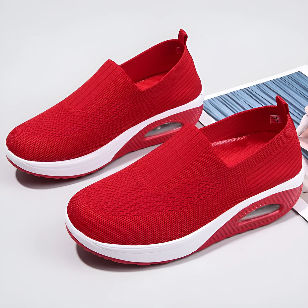 Women's mesh running shoes in beige with round toe and air cushion midsole.