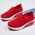 Women's mesh running shoes in beige with round toe and air cushion midsole.