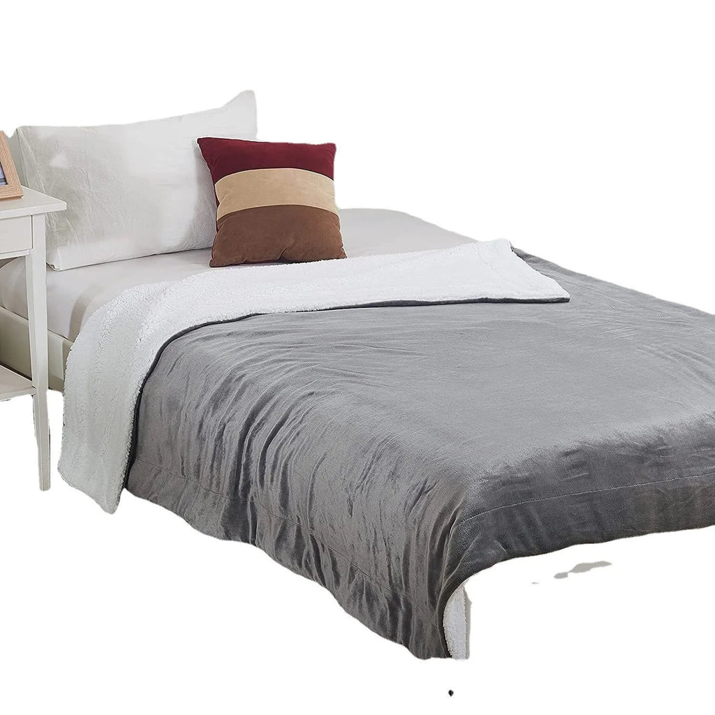 Grey and white USB electric heating blanket with temperature controls on soft flannel fabric.