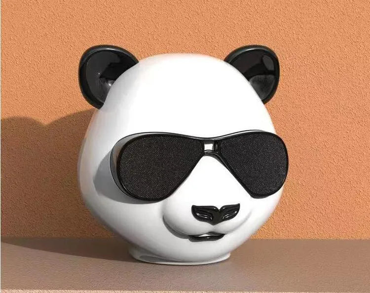 Portable mini Bluetooth speaker with classic styling showing front speaker grill and control buttons