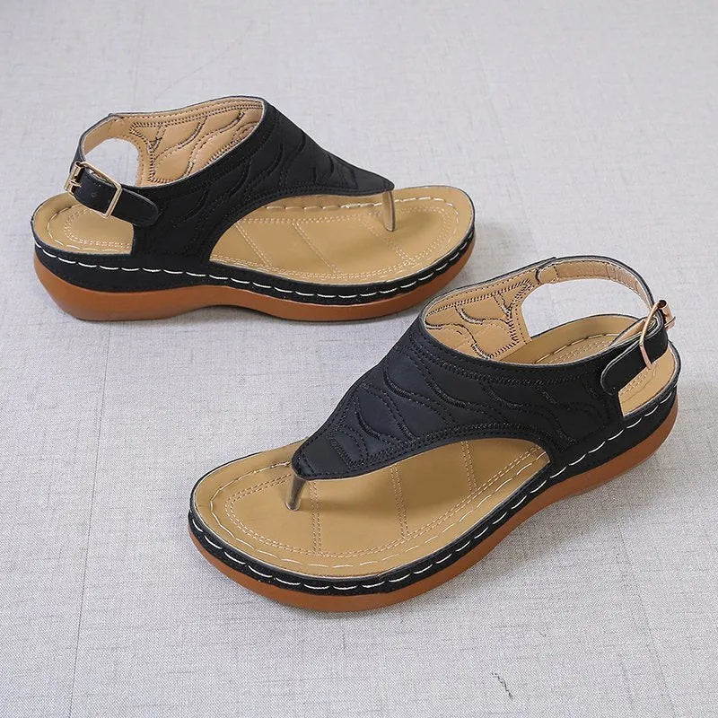 Women's casual wedge heel flip flop sandals with an adjustable back strap in solid colours.