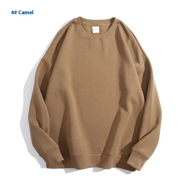 A loose round neck off shoulder pullover sweater in a solid colour, with long sleeves.