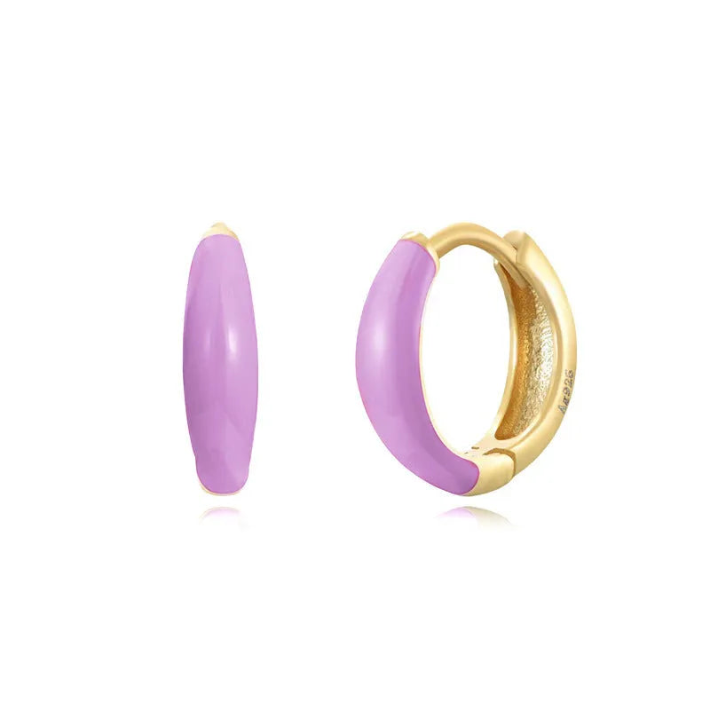 Geometric U-shaped oval epoxy earrings in dripped oil colours on copper wire.