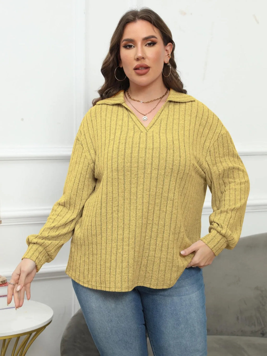 Women's plus size grey polo collar blouse with lantern sleeves, made from polar fleece fabric.