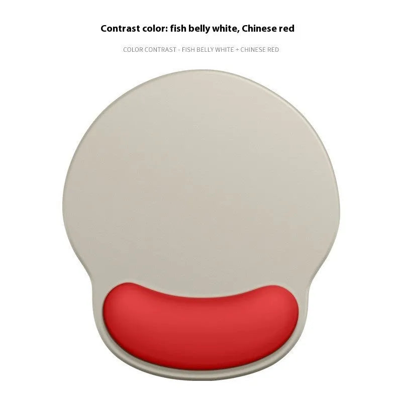 Silicone mouse mat with attached gel wrist support in a gradient blue colour on a desk.