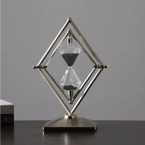 Glass sand timer ornament with zinc alloy metal base showing sand flow timing mechanism