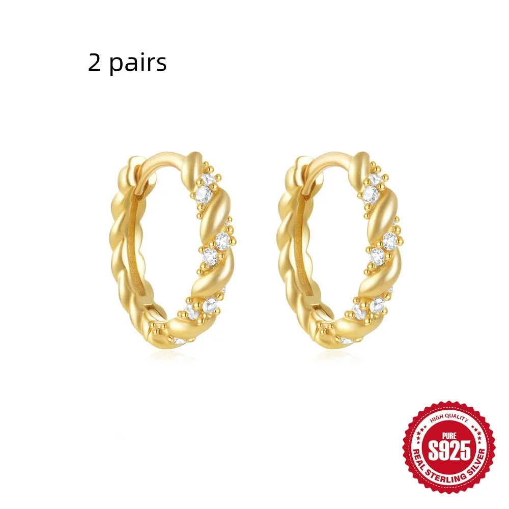 Sterling silver geometric stud earrings with small round designs in gold or silver electroplated finishes