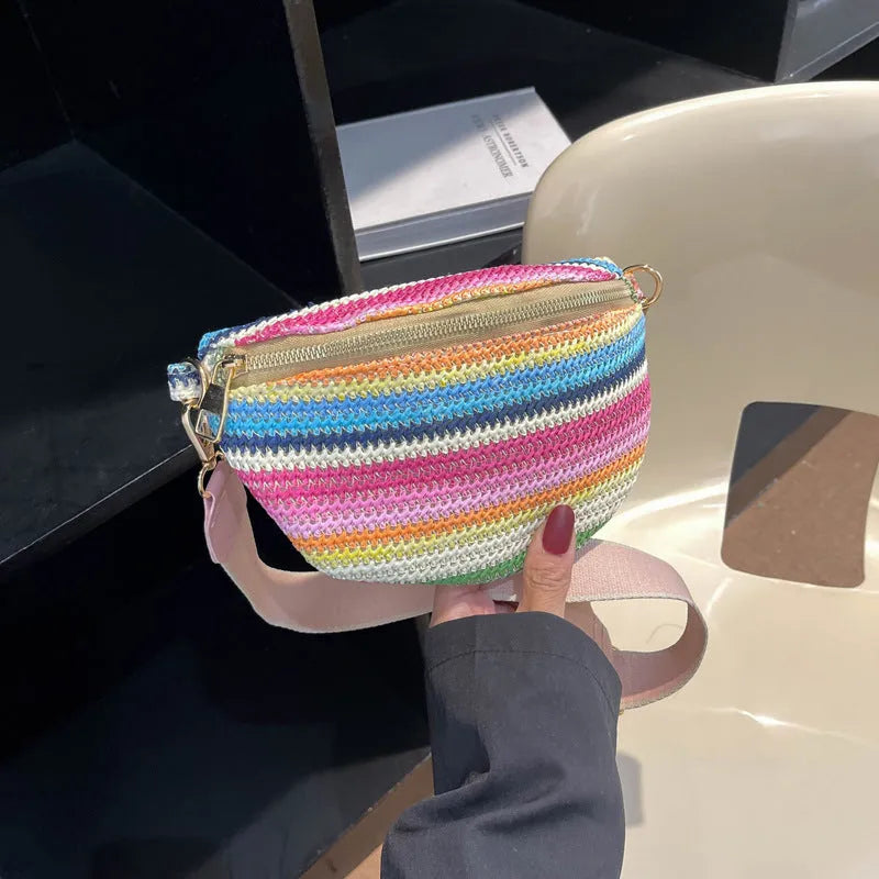 Women's woven straw beach bag with single shoulder strap in blue or pink
