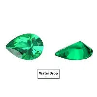 Loose cultivated emerald gemstone in Columbia green colour showing round and fancy cut shapes on a white background.