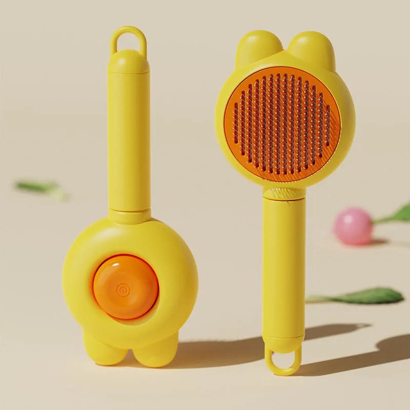 Self-cleaning pet grooming brush with release button in green, pink, purple or yellow colours