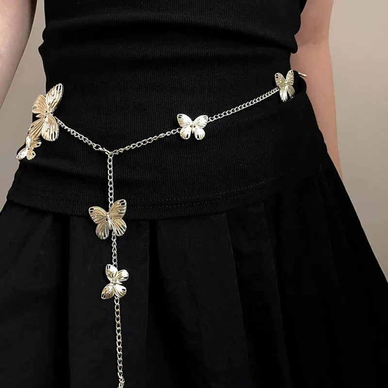 Gold and silver alloy waist chain with butterfly ornament, showing 104cm length.